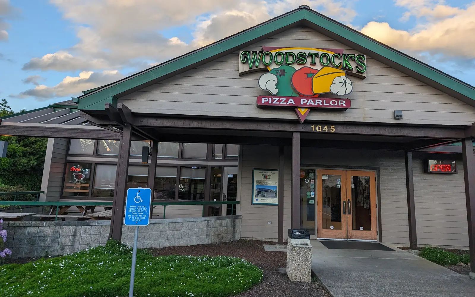 The Woodstock's Pizza Parlor sign over the front doors at 1045 NW Kings Blvd